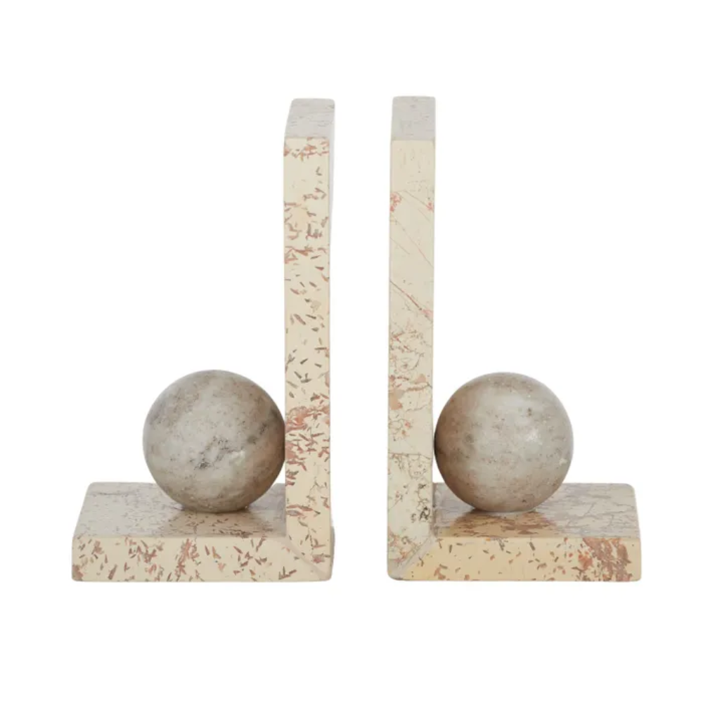 Marble bookends with spherical stones on a white background