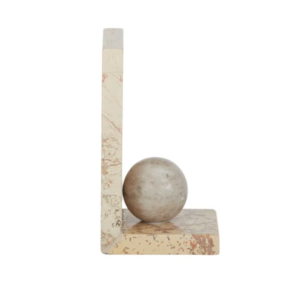Marble bookend with spherical object on a white background