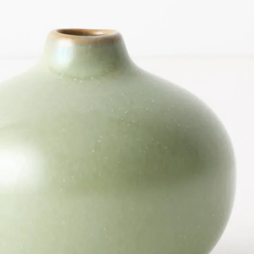 Close_Up_Of_Green_Ceramic_Bud_Vase_white_background