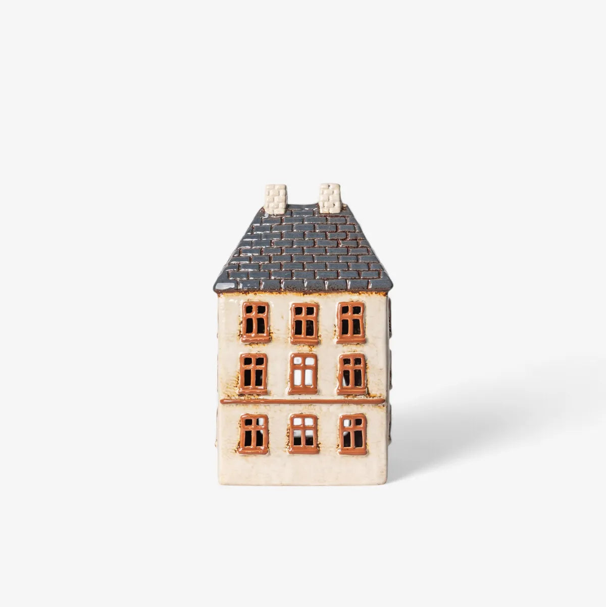 Small ceramic house on a white background