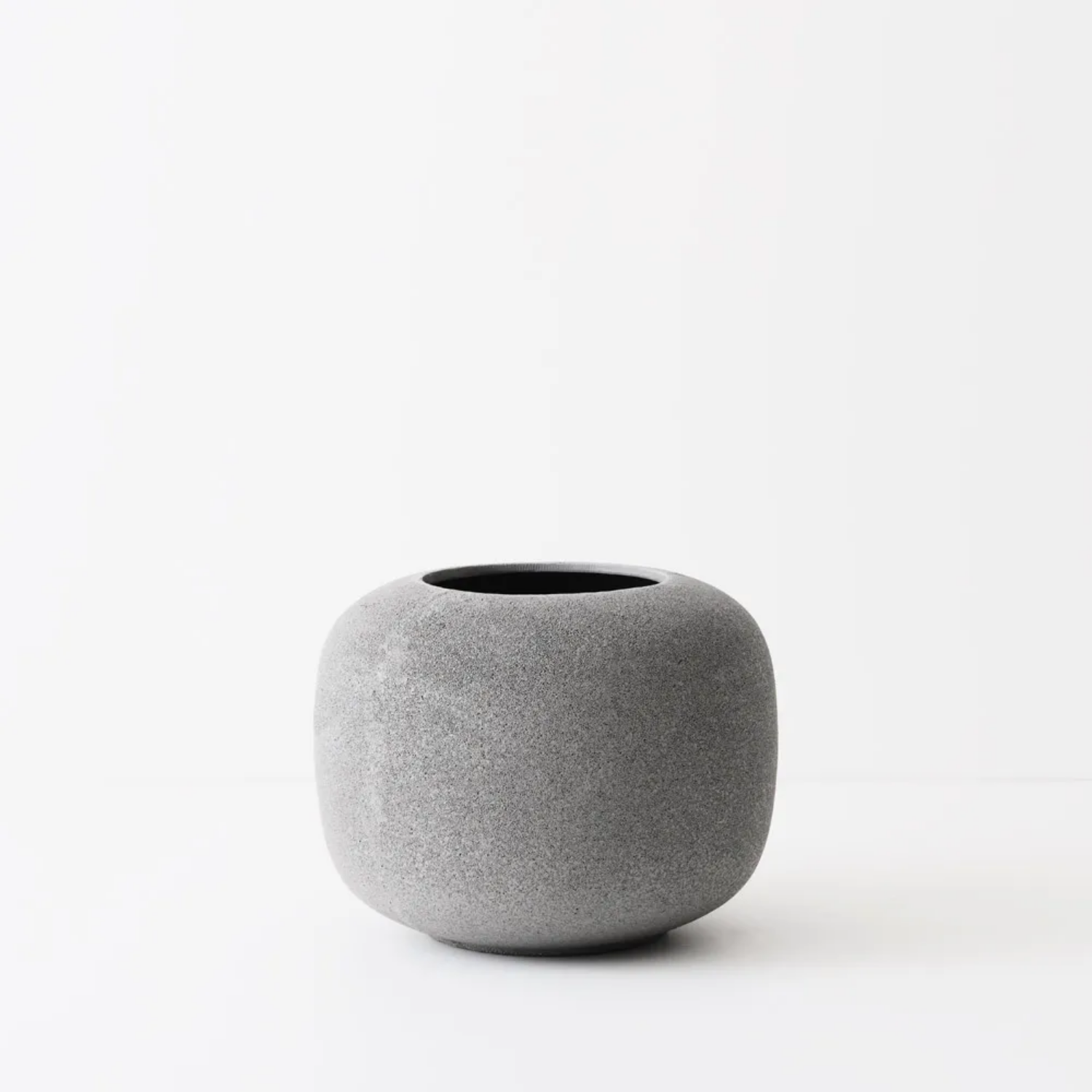 Gray textured pot on a white background