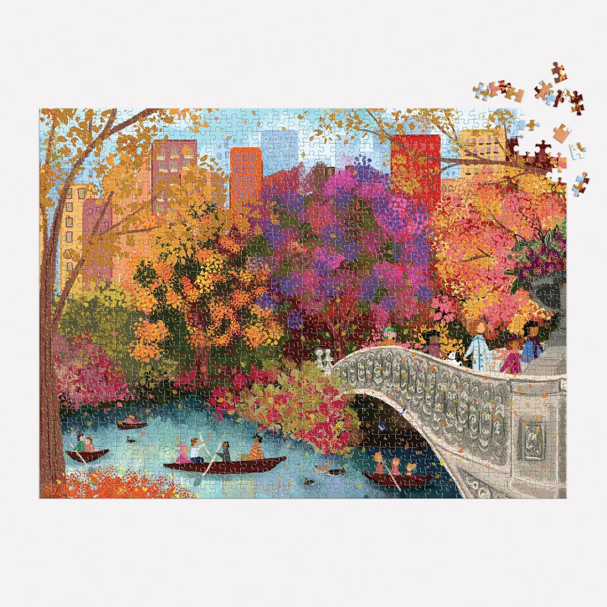 Jigsaw puzzle with a colorful scene of a park with people on boats and a bridge.