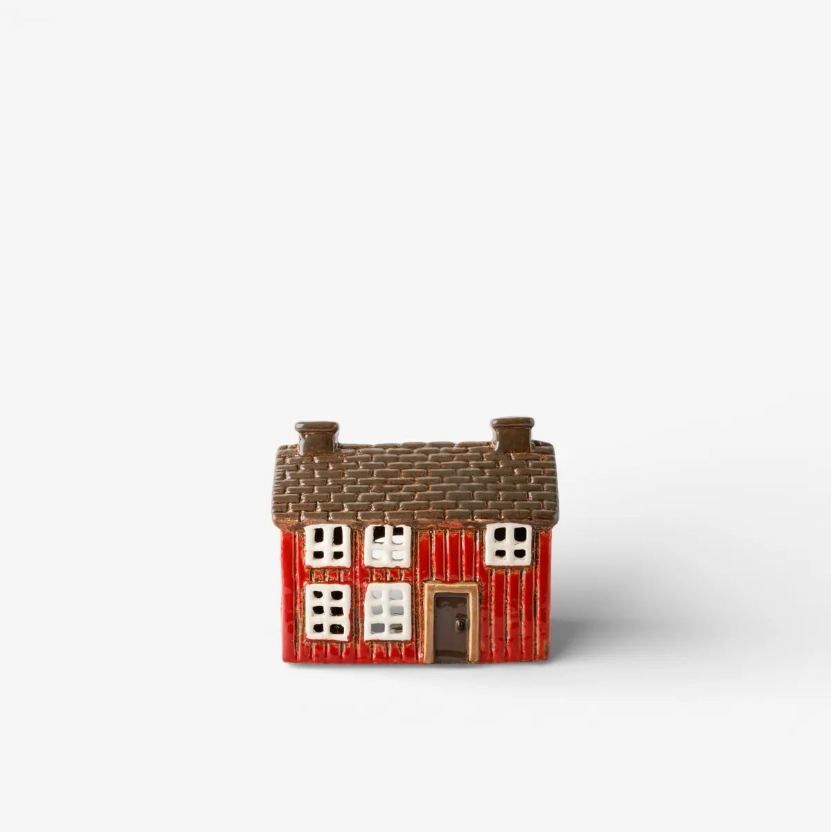 Small model of a house with a red base and brown roof on a white background