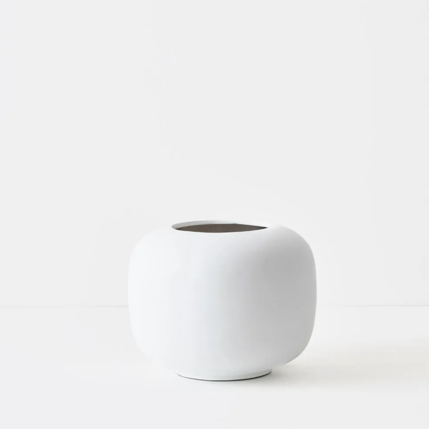 White ceramic planter on a white background