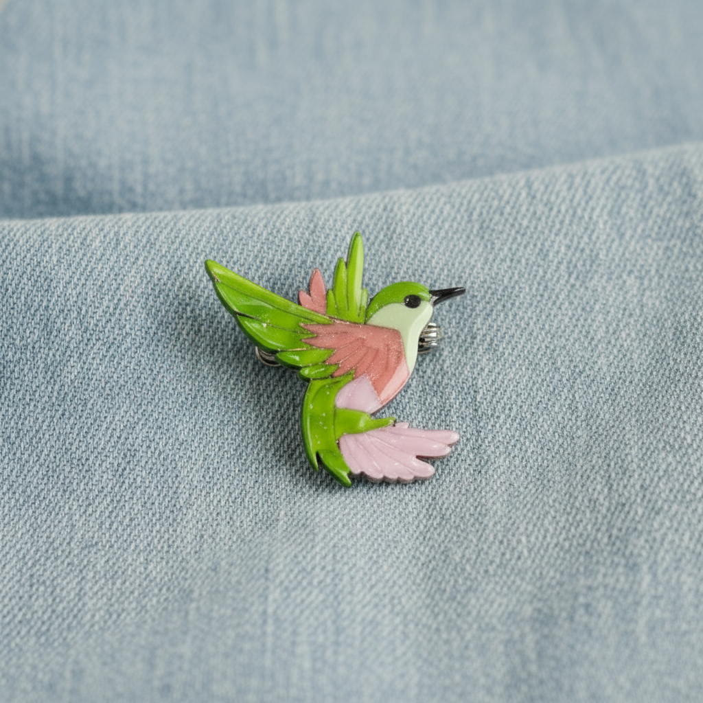 Hummingbird Brooch on pale denim background