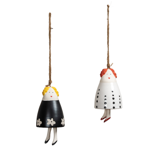 Two hanging ceramic bells with different hairstyles and outfits on a white background