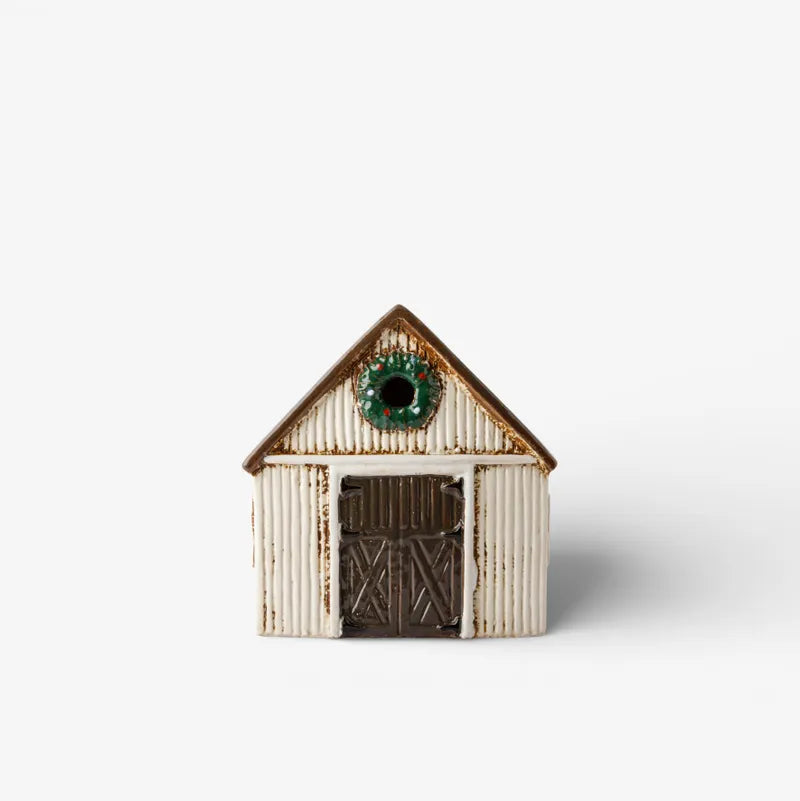 Small Tealight barn with a green roof on a white background