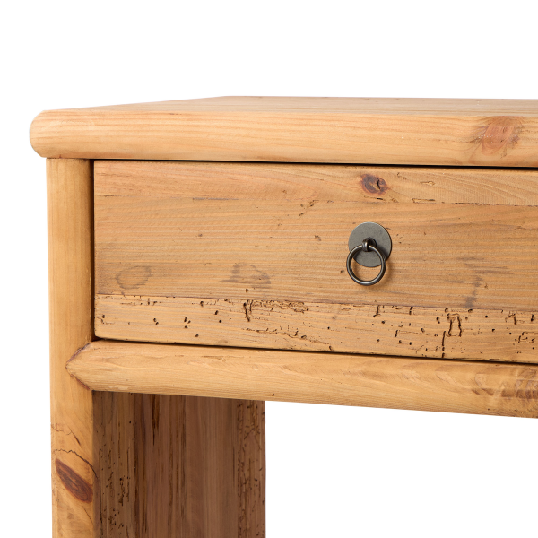 Close-up of a wooden drawer with a metal handle on a white background