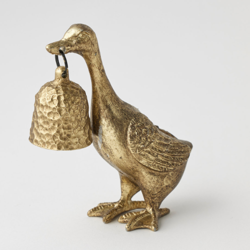 Gold duck candle snuffer on a light gray background