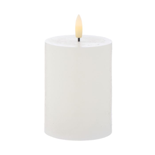 White candle with an LED wick on a white background