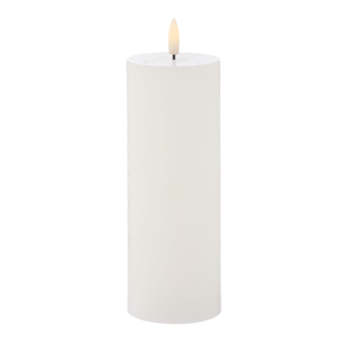 White candle with an LED wick on a white background