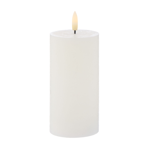White candle with LED wick on a white background