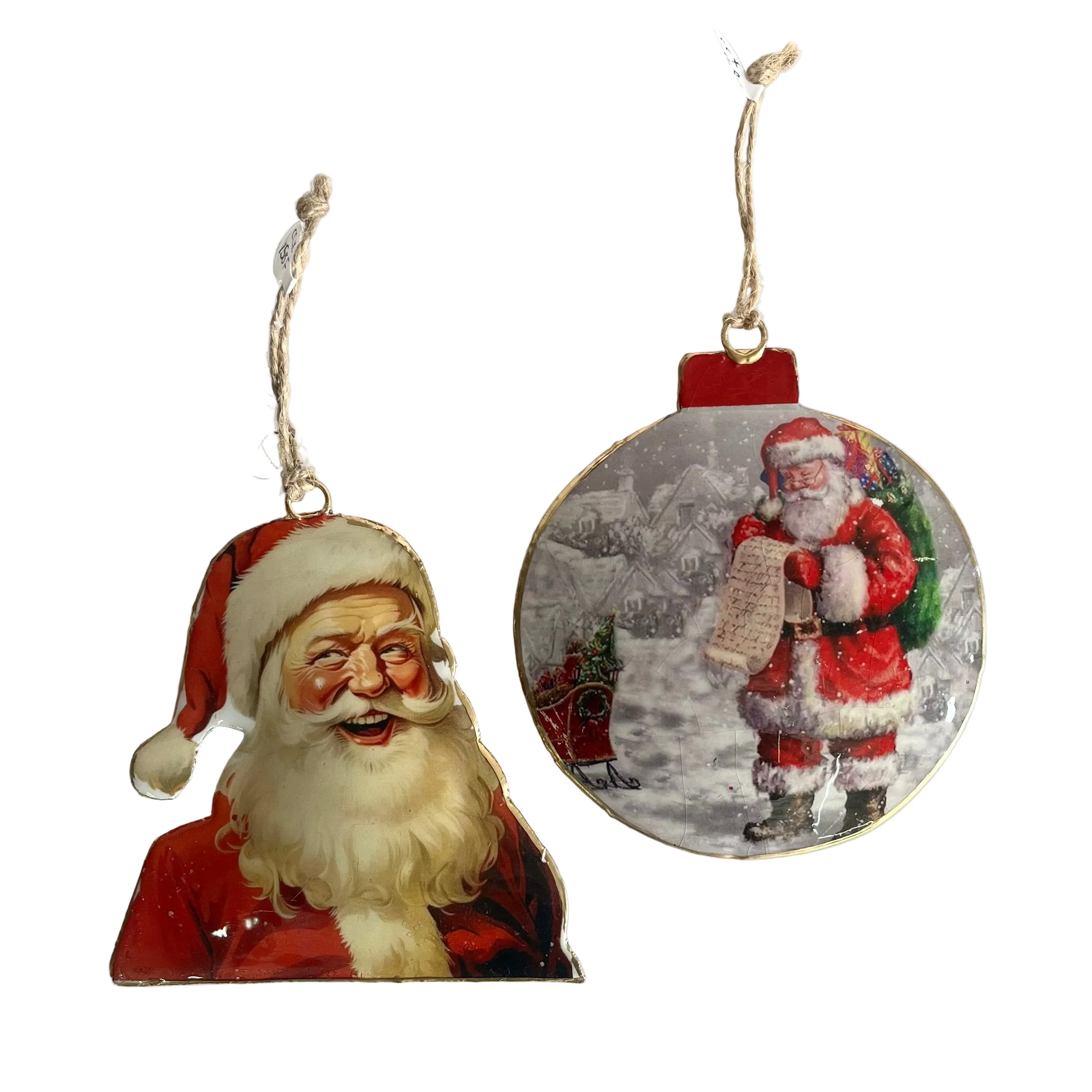 Two vintage Christmas ornaments on a white background: one irregular-shaped ornament with a painted Santa Claus face and red hat, and one round ornament showing Santa walking in the snow while reading a letter.
