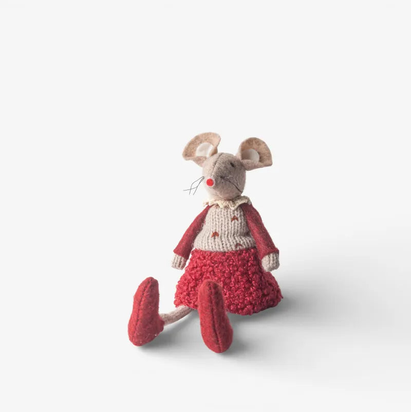 Stuffed toy mouse in a red outfit on a light gray background