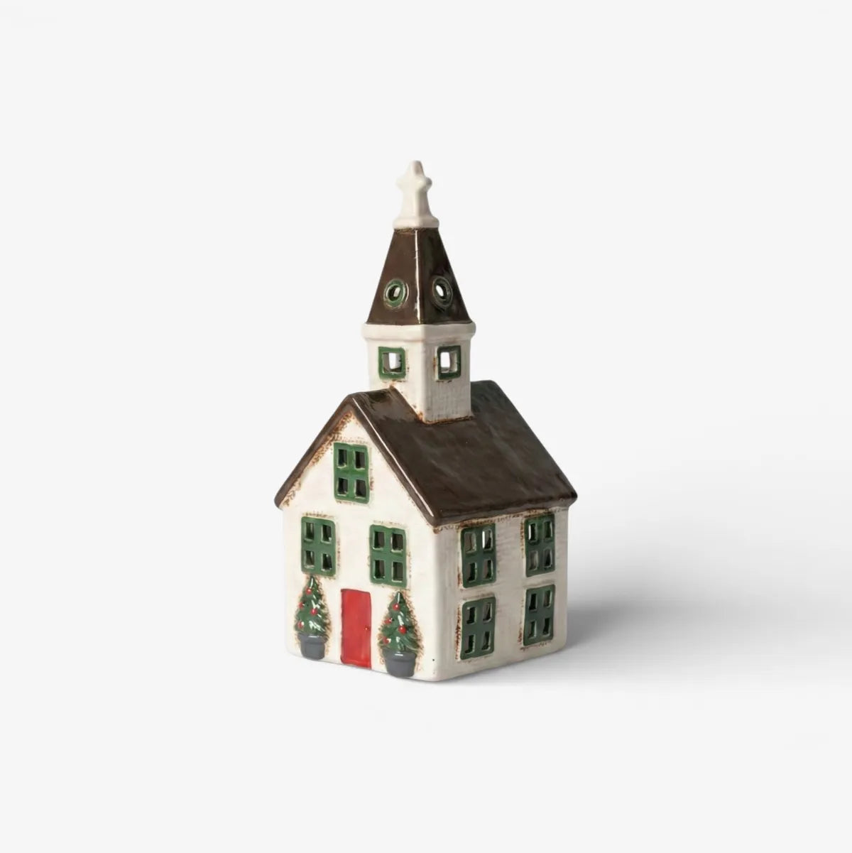 Small model of a house with a clock tower on a white background