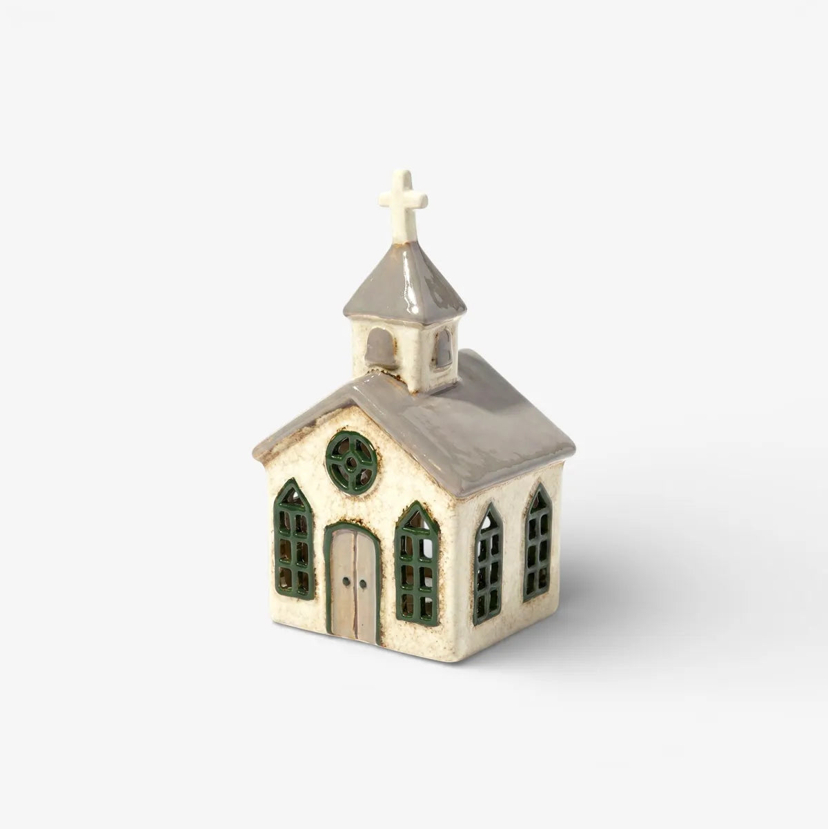 Small model of a church with a steeple on a white background